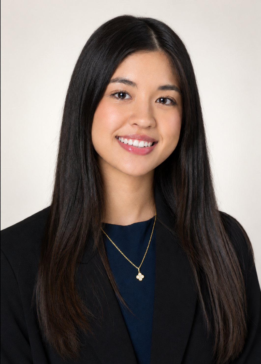 Team member headshot against a soft off-white background